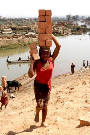 Young Woman Carrying Bricks All Day  Antananarivo.